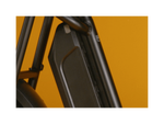 Zoomed in image a black Safe Shield battery on a black bike. 