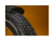 Close up of an ebike tire tread pattern against a gold background.
